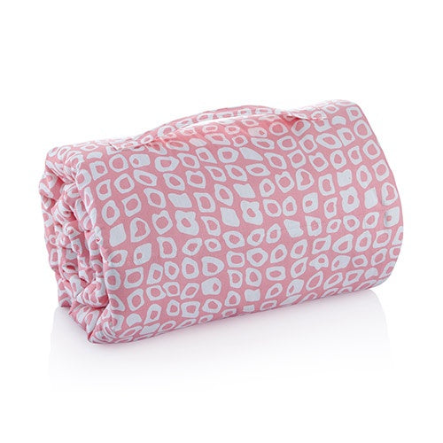Stack of folded baby blankets with pink, gray, and green patterns on a white background