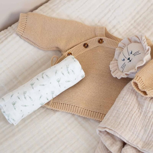 Three folded fabric swatches with a subtle pattern on a white background