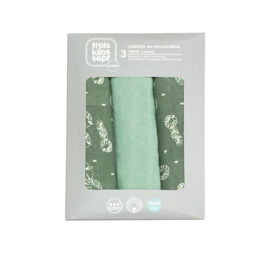 A set of three green and white leaf-patterned muslin swaddles for babies by Trois Kilos Sept, sized 70x70cm.