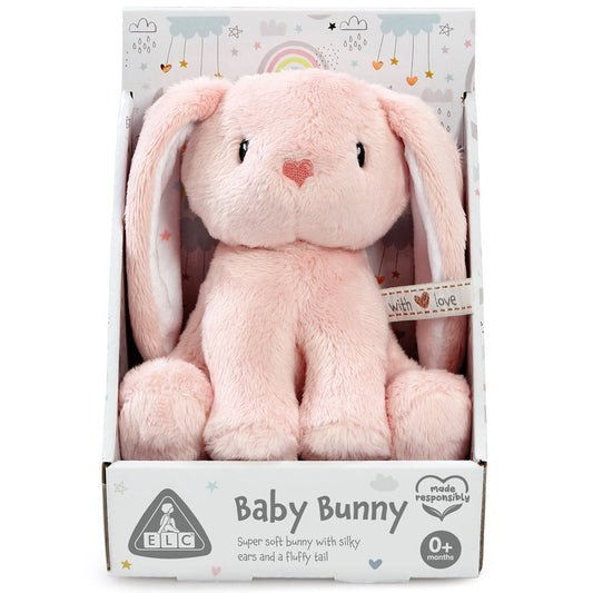 Pink plush bunny toy with a heart on a white background