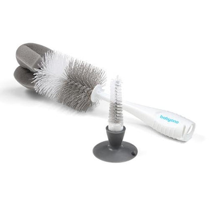 Gray Babyono bottle brush featuring a sponge tip, suction cup stand, and a hidden nipple cleaning brush in the handle.