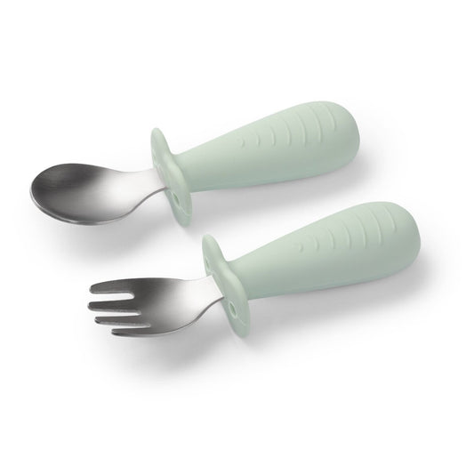 Green Babyono stainless steel spoon and fork set featuring safety guards and ergonomic silicone handles for toddlers.