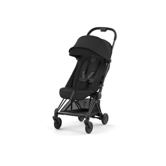 An ultra-compact Cybex Coya Platinum stroller in Sepia Black with a matt black frame, showcasing its sleek design and premium travel features.