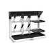 Dr. Brown’s black and white vertical drying tower for baby bottles and accessories on a kitchen countertop.