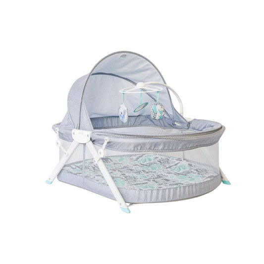 Grey Infantino Fold & Go Bedside Bassinet with Koala theme and adjustable sun canopy.