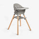 A modern Kikkaboo 2-in-1 wooden highchair with natural wood legs and a white seat, shown in both highchair and low toddler chair modes.