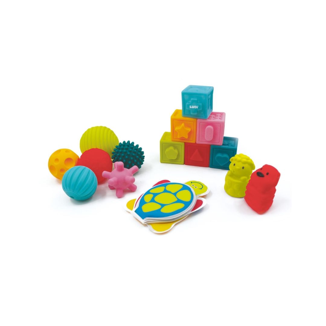 A vibrant collection of multicolored textured balls and soft blocks from the Ludi sensory discovery set.