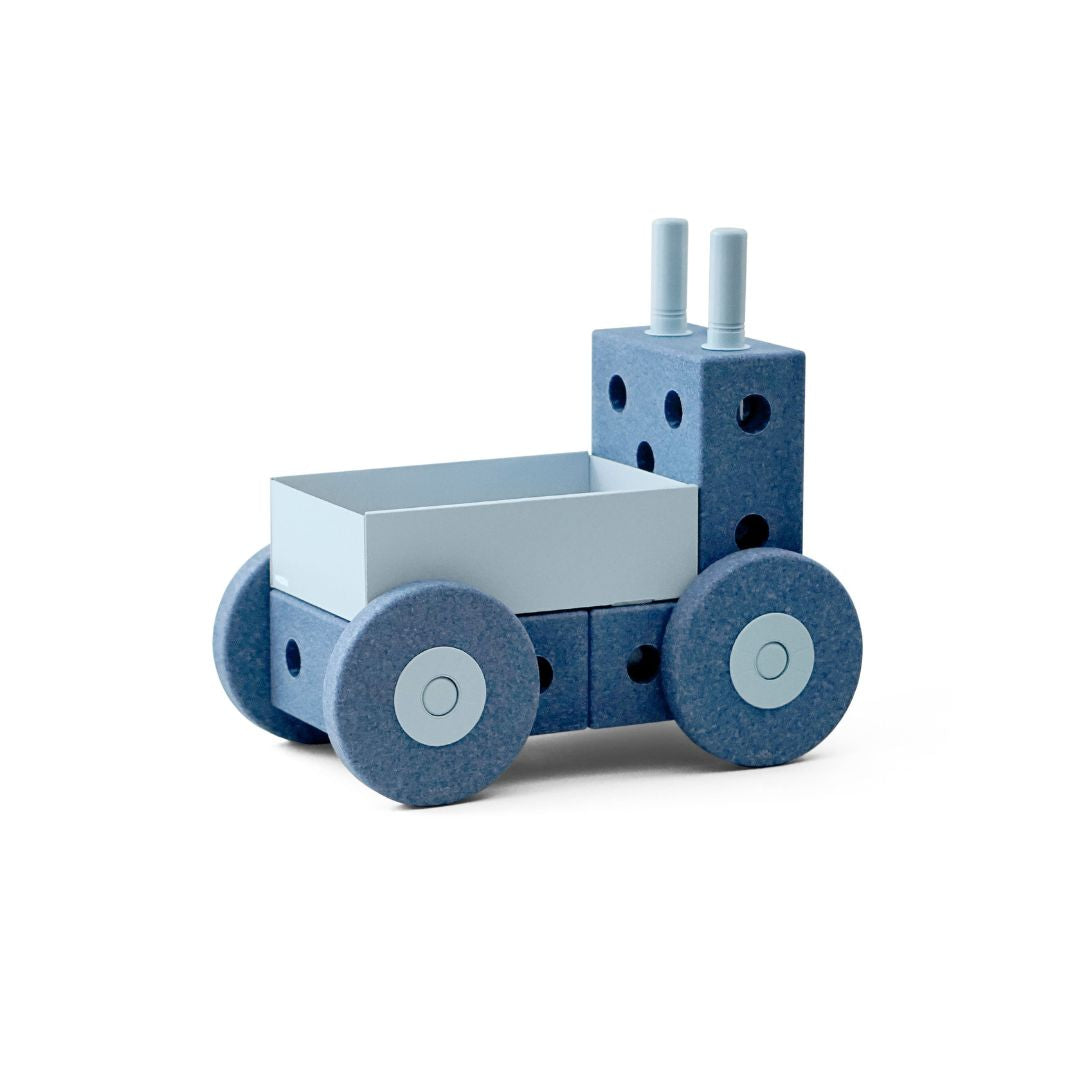 Toy truck with blue body and white cargo box on a white background