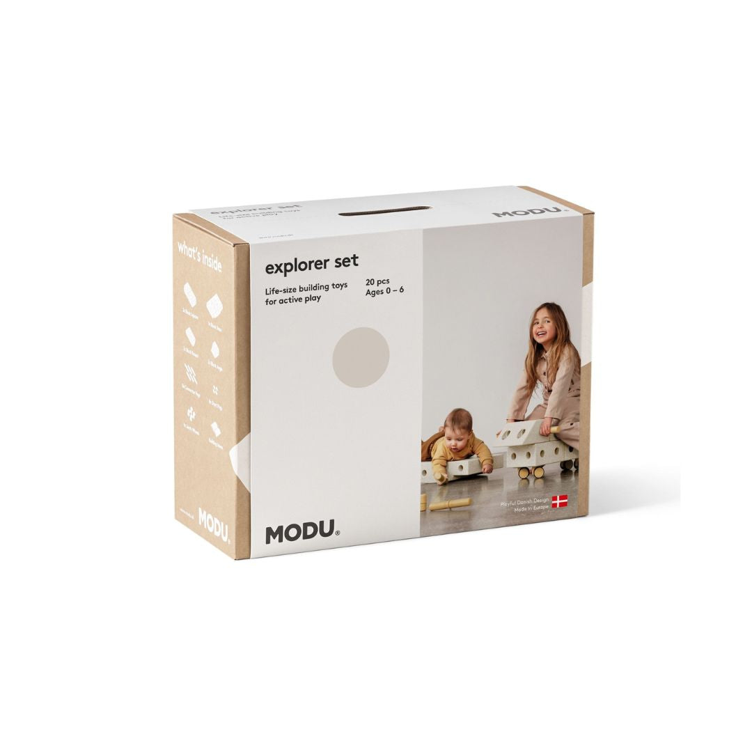 Child riding a custom-built MODU ride-on toy made from the Explorer Set components.