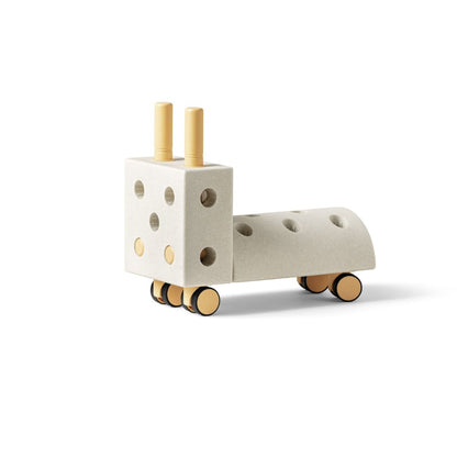 MODU Tiny Ride in Sand Grey and Honey Yellow showing a sleek, modern ride-on toy for toddlers.