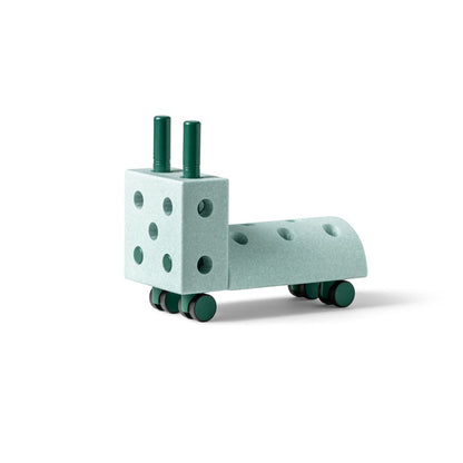 MODU Tiny Ride in Ocean Mint and Forest Green showing the compact ride-on assembly.