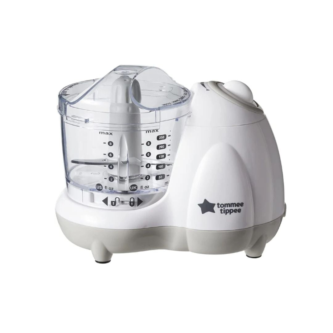 Compact Tommee Tippee baby food blender with a clear bowl and white base, ideal for making purees.