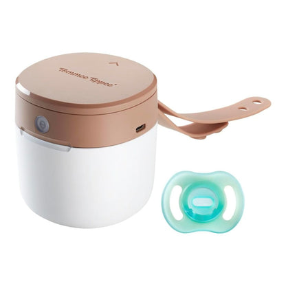 A compact white Tommee Tippee NightGlow Pod with a glowing silicone strap and a glow-in-the-dark soother inside.