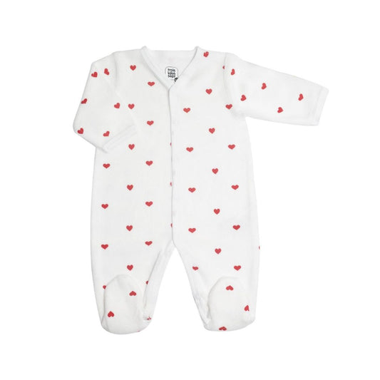 An ecru-colored long-sleeve baby sleepsuit with a red heart pattern by Trois Kilos Sept, sized for 6 months.