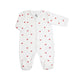 An ecru-colored long-sleeve baby sleepsuit with a red heart pattern by Trois Kilos Sept, sized for 6 months.