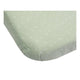 A set of two 100% cotton fitted sheets for a baby crib by Trois Kilos Sept, featuring one solid olive green and one geometric print.