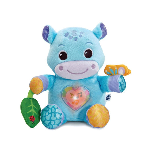A soft blue VTech plush hippo named Theo with a glowing heart on its tummy, designed for infants.