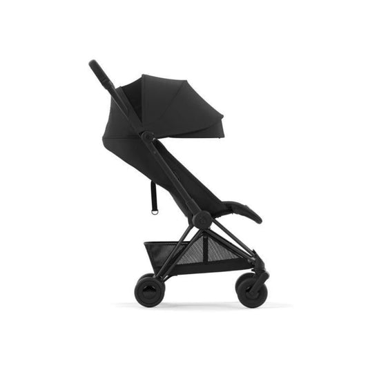 An ultra-compact Cybex Coya Platinum stroller in Sepia Black with a matt black frame, showcasing its sleek design and premium travel features.