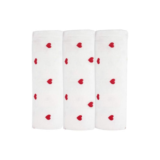 Three white socks with red heart patterns on a white background
